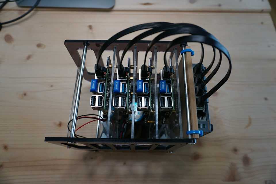 Fully assembled case with switch, cables, USB sticks and the raspberries